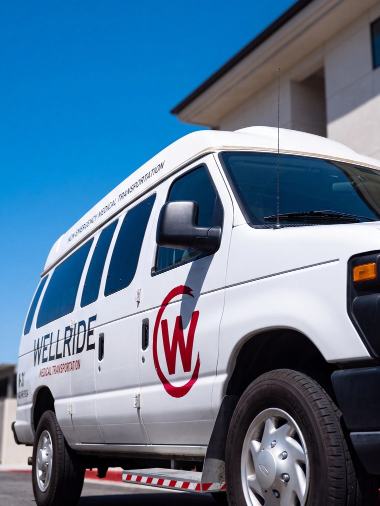 Side view of a Wellride wheelchair-accessible medical transport van in San Diego